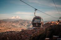 Stunning aerial view of La Paz with cable car transport at sunset.