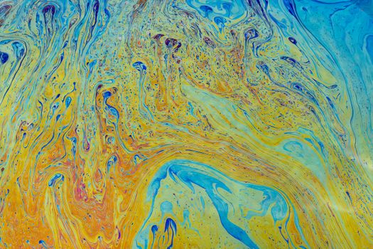 Colorful abstract design featuring vibrant swirling patterns in blue, yellow, and orange hues.