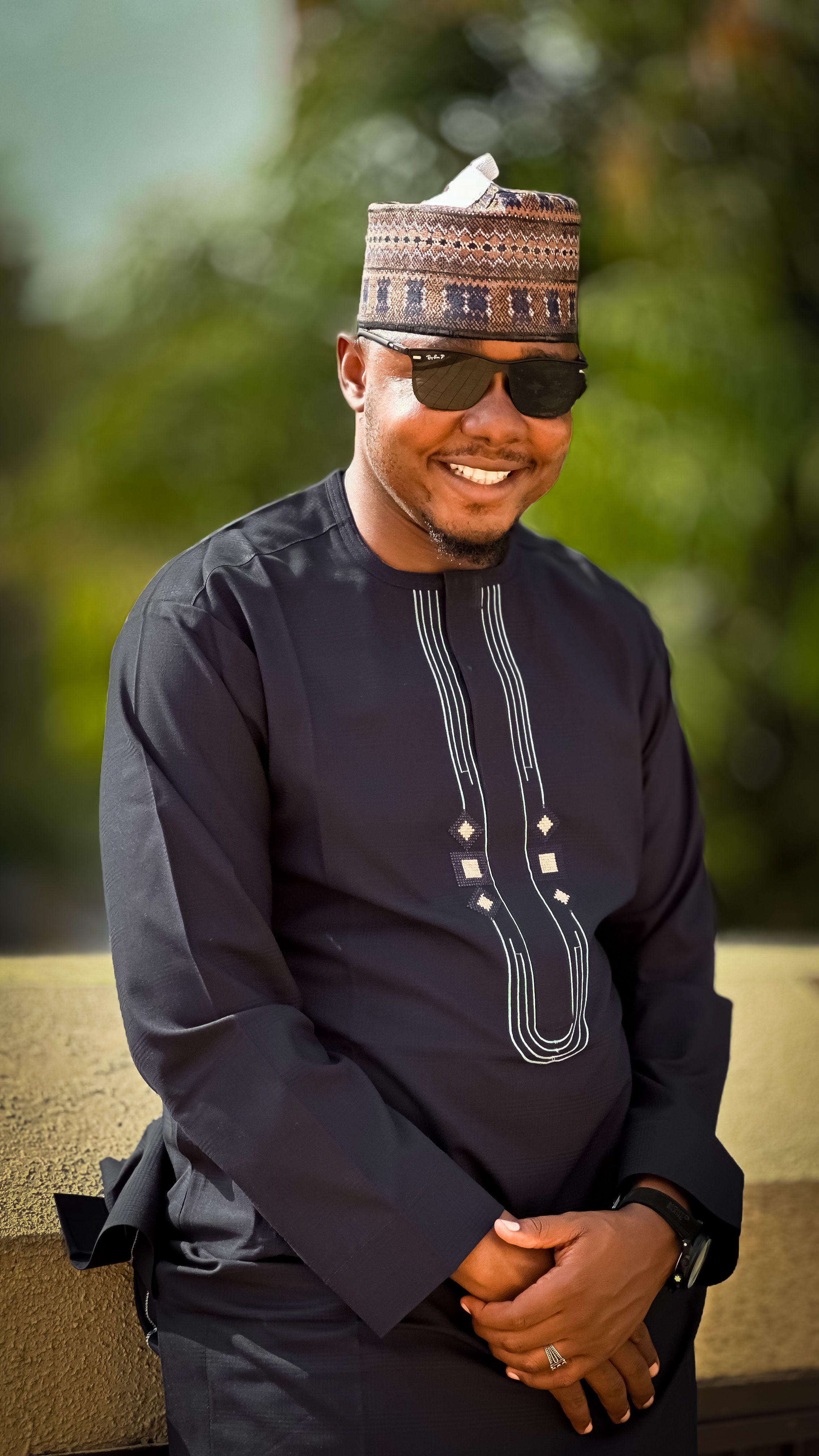 Portrait of a Smiling Man in Traditional Attire · Free Stock Photo