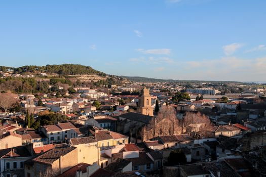 Scenic view of Miramas, France with rooftops and distant hills under a clear blue sky.