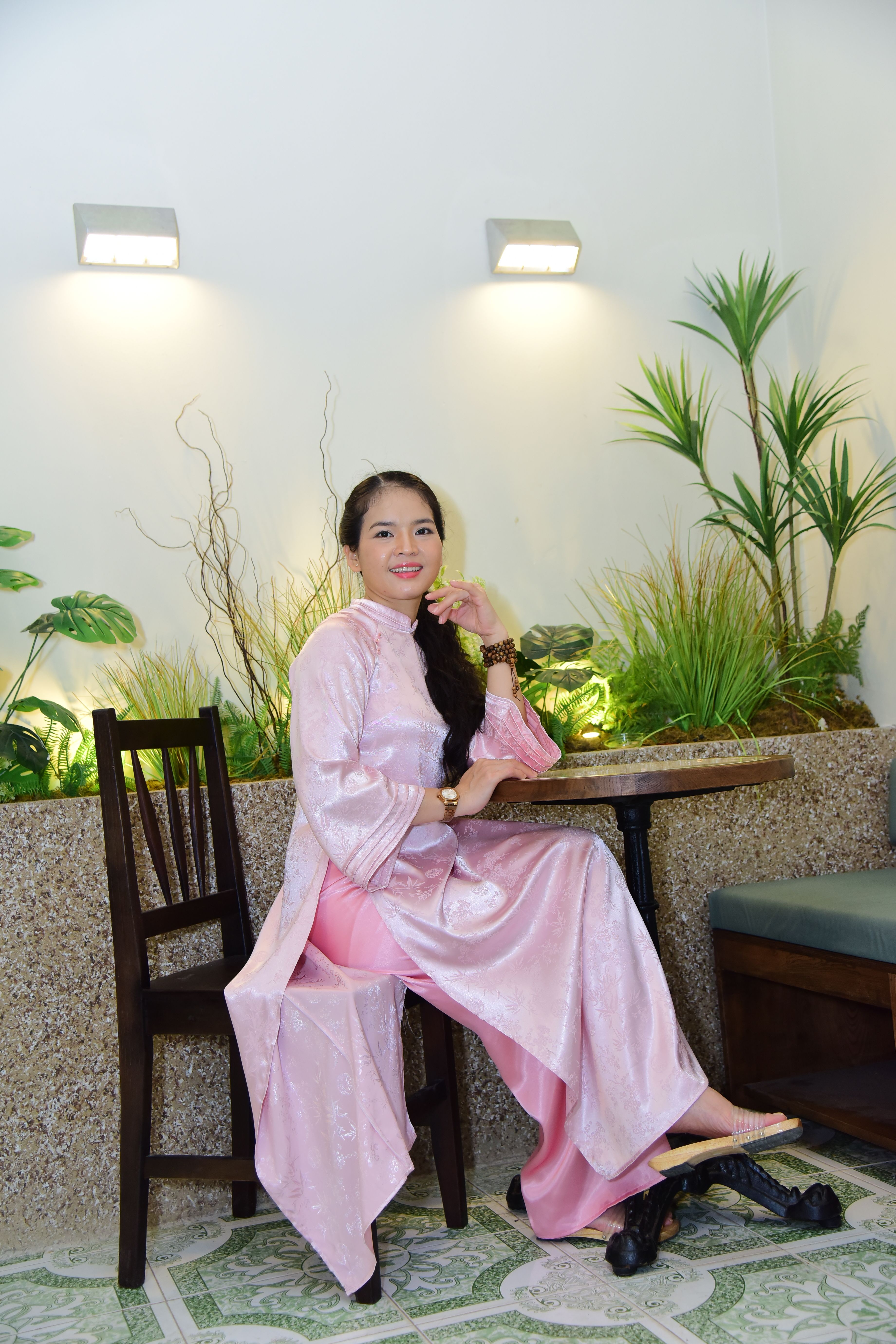 Elegant Woman in Traditional Pink Dress Indoors · Free Stock Photo