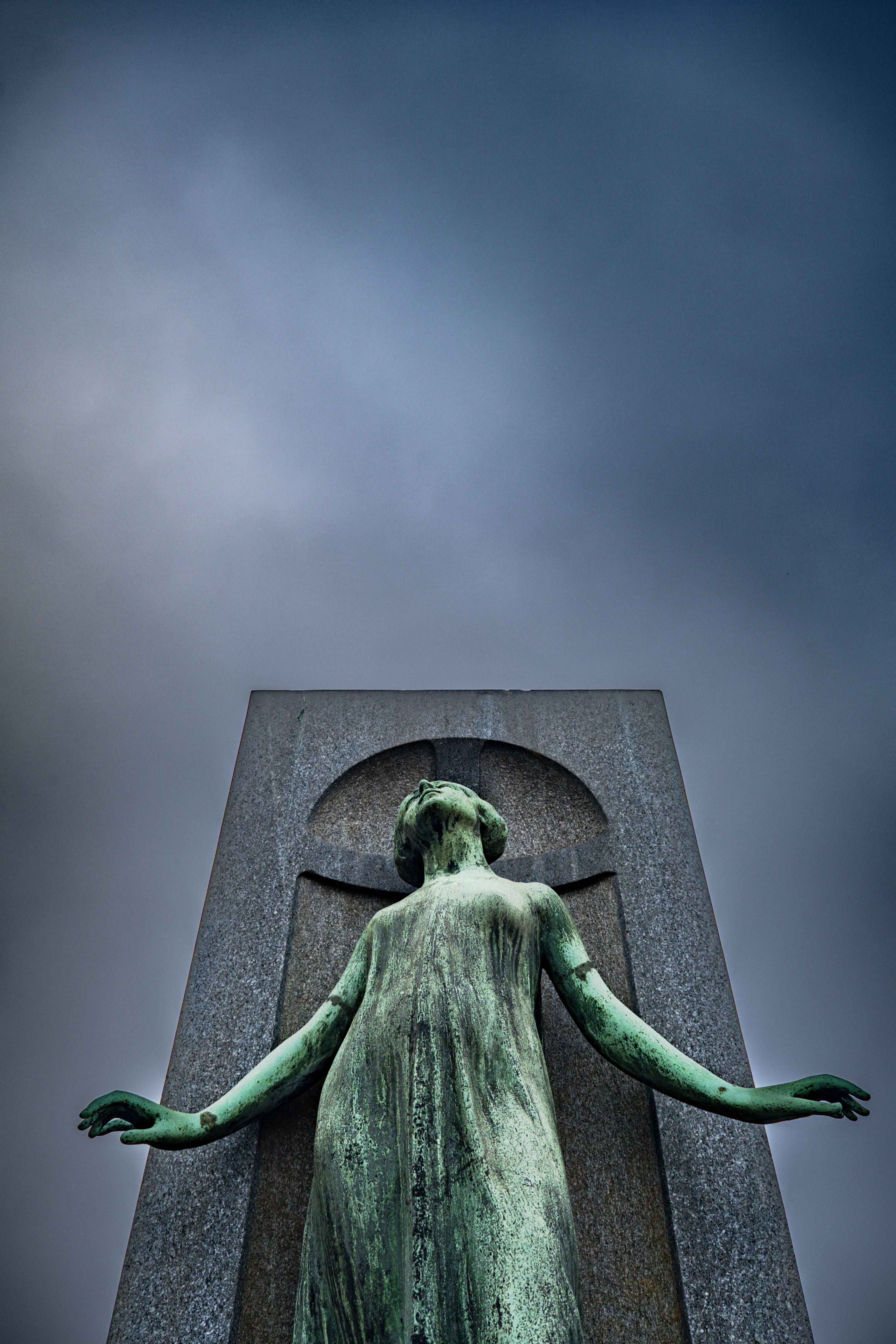 Dramatic Statue Against Moody Sky · Free Stock Photo