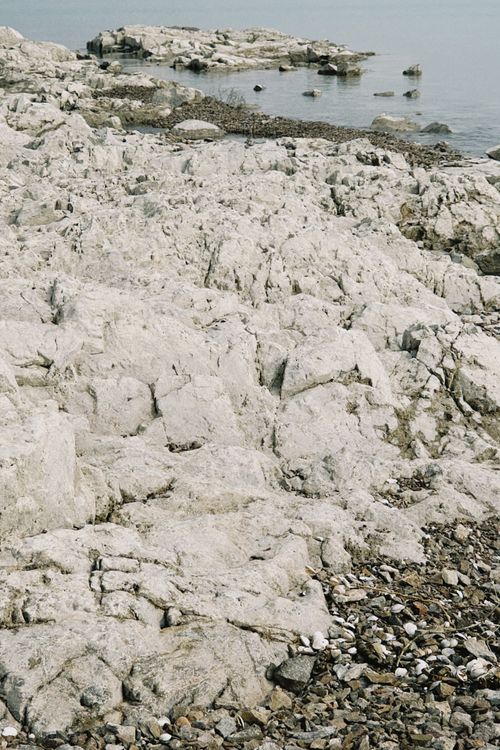 Free Explore the rocky shoreline and tranquil waters in Konaev, Almaty Region, offering a serene natural landscape. Stock Photo