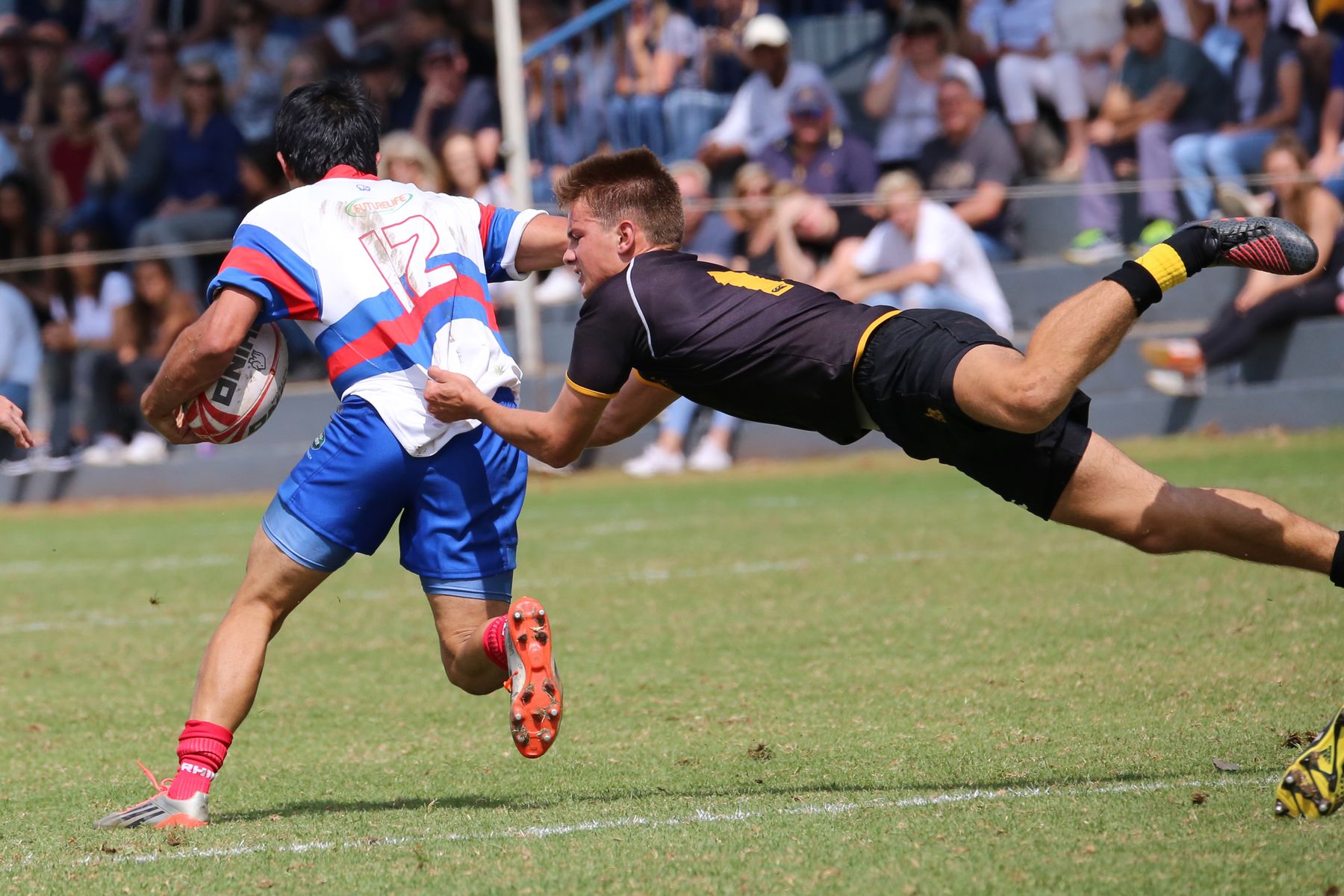 Full-stretch try-saving tackle at Kingsfold Park