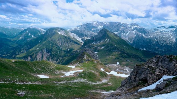 Experience the mesmerizing alpine landscape of Vorarlberg, Austria, with lush greenery and majestic peaks.