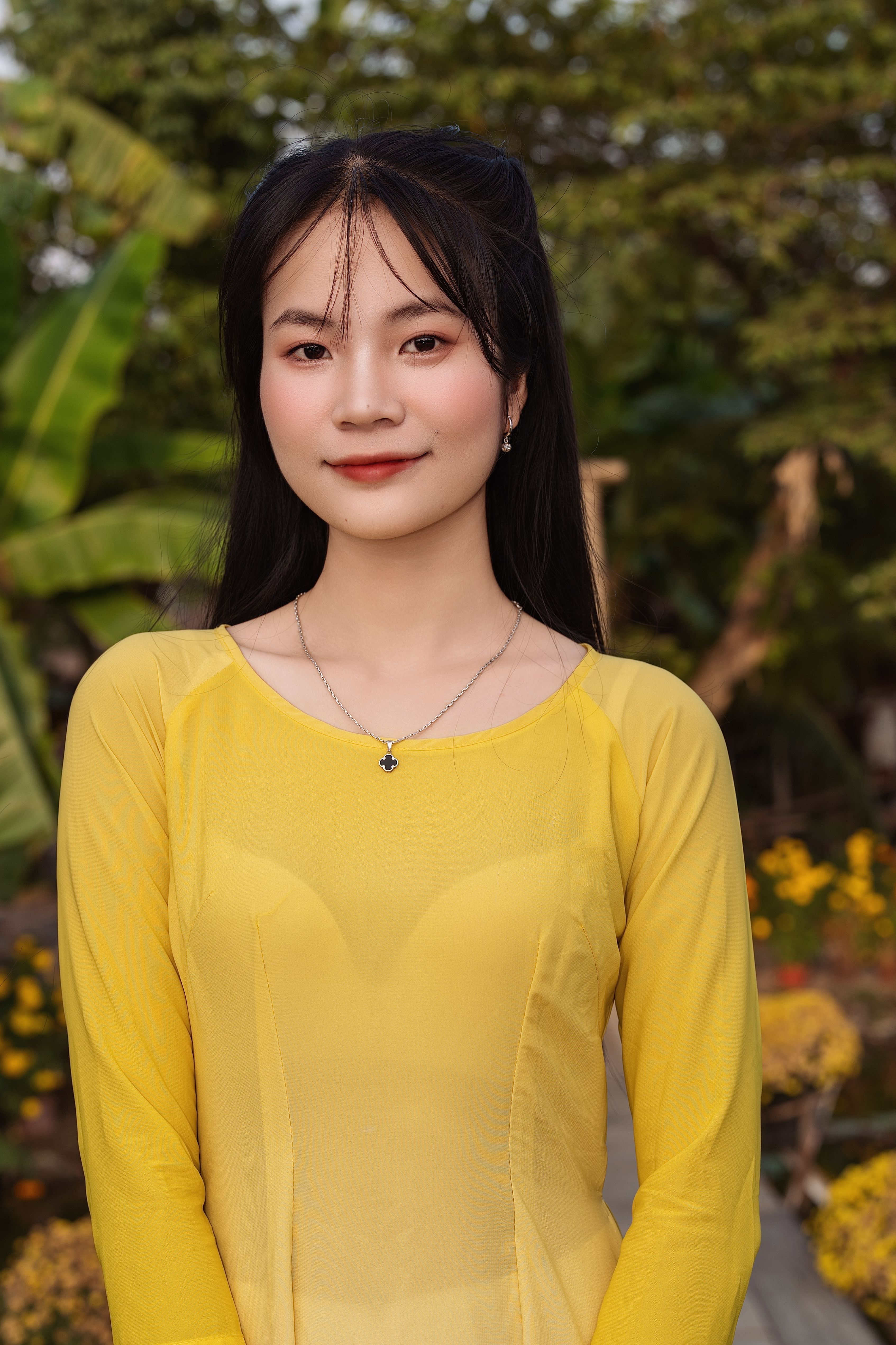 Portrait of a Woman in a Yellow Dress Outdoors · Free Stock Photo