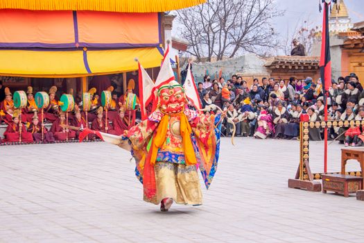 Vibrant traditional dance festival at Huangnan, Qinghai with colorful costumes and cultural significance.