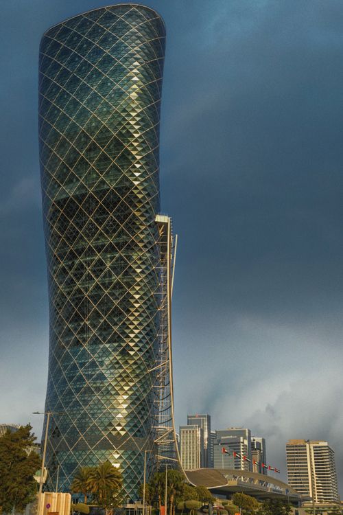 Free Stunning view of the Aldar HQ tower against Abu Dhabi skyline. Modern architecture at its best. Stock Photo