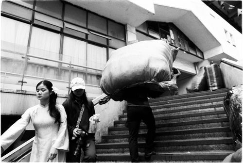 Free Candid black and white photo capturing urban street life with people navigating stairs. Stock Photo