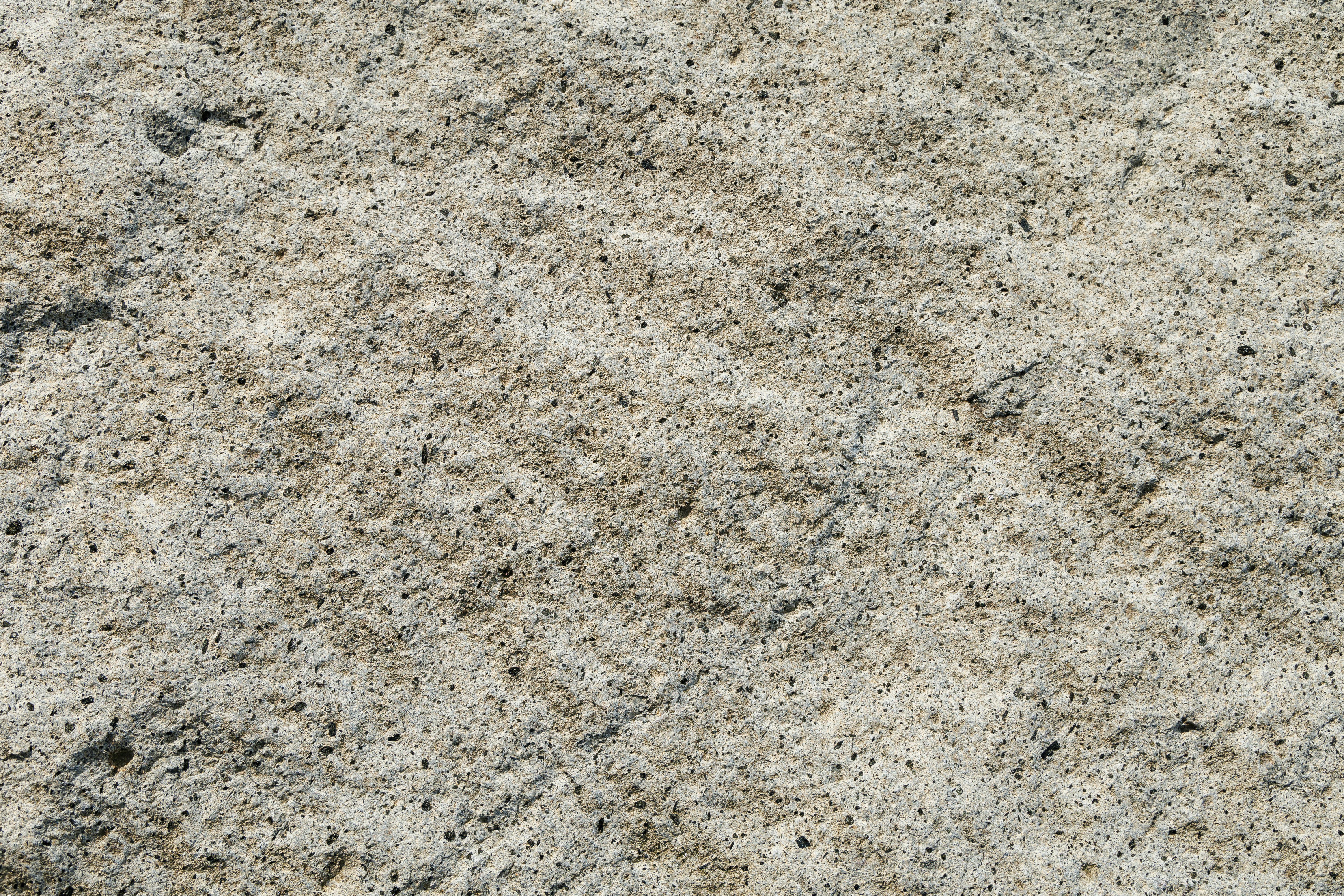 De franc Imatge detallada d'una textura de pedra rugosa que mostra patrons i colors naturals. Foto d'estoc