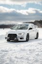 White Sports Car Drifting on Snowy Winter Road