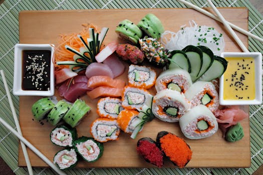 Colorful sushi platter on a wooden board with sauces and traditional garnishes, perfect for culinary presentations.