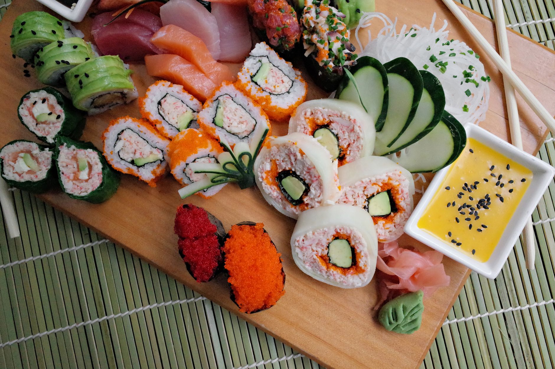 Close-up of sushi decorated with tobiko eggs