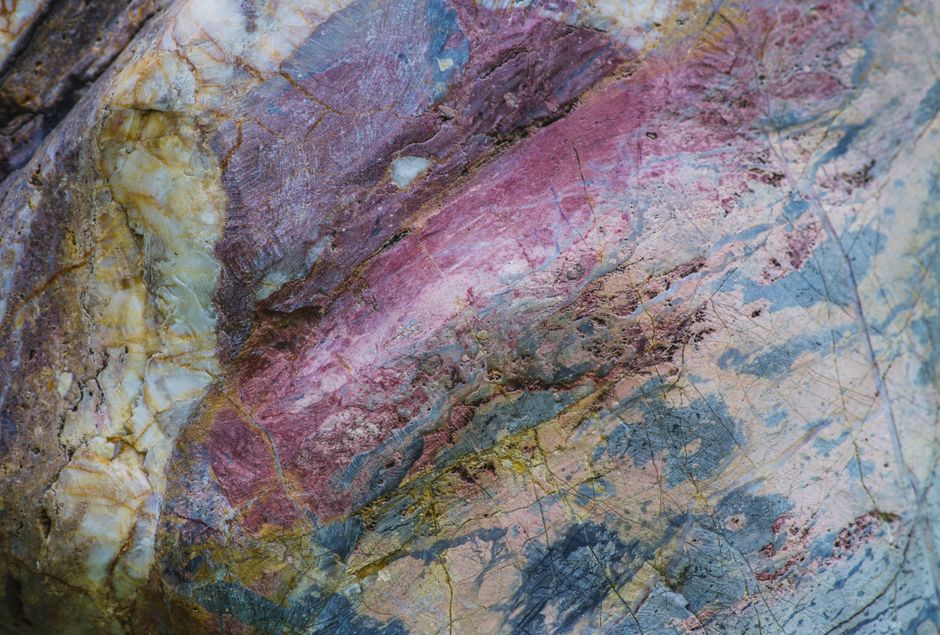Close-up of a multicolored stone texture showcasing natural patterns and colors in Kyiv, Ukraine.