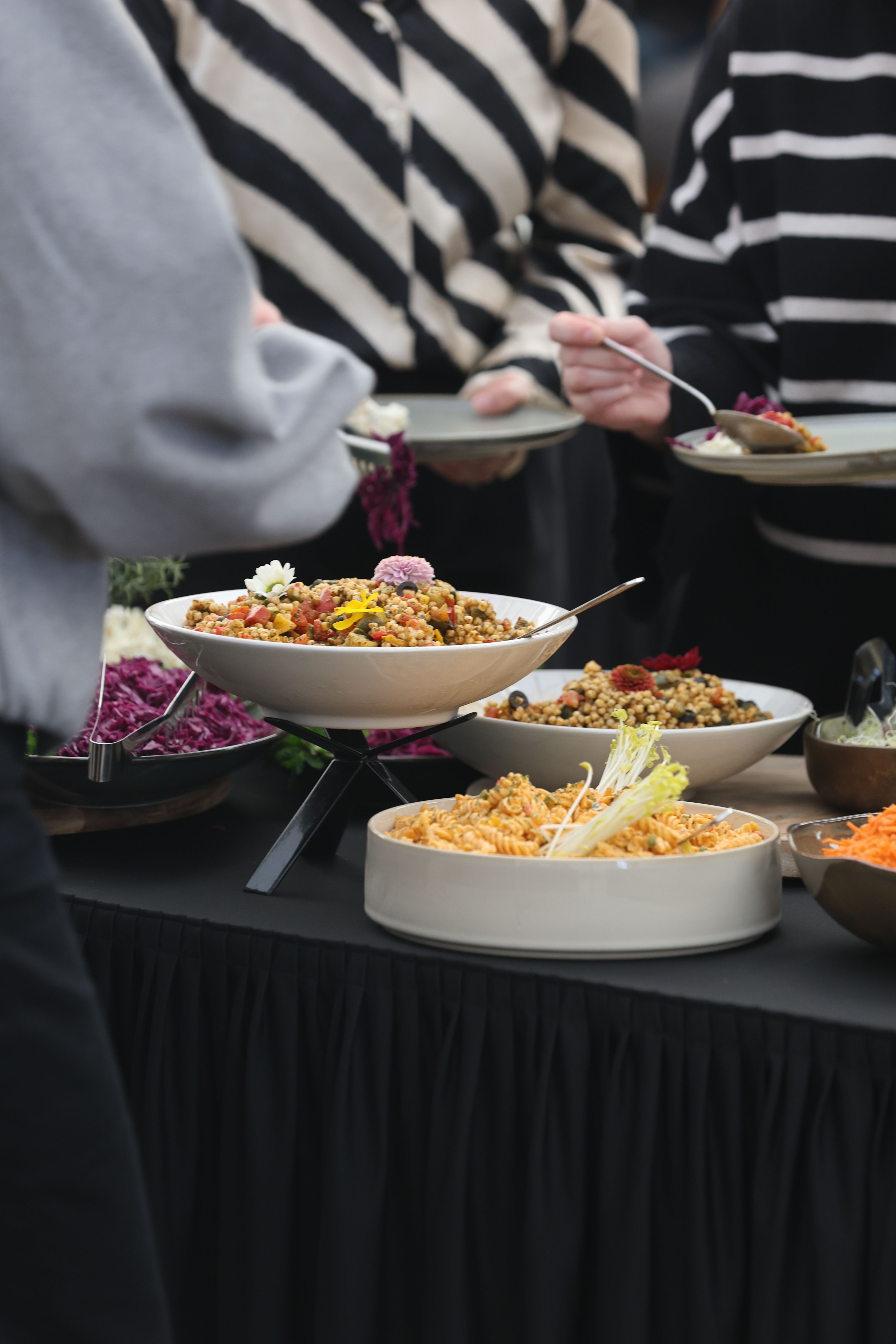 Vibrant Buffet Table with Colorful Dishes · Free Stock Photo