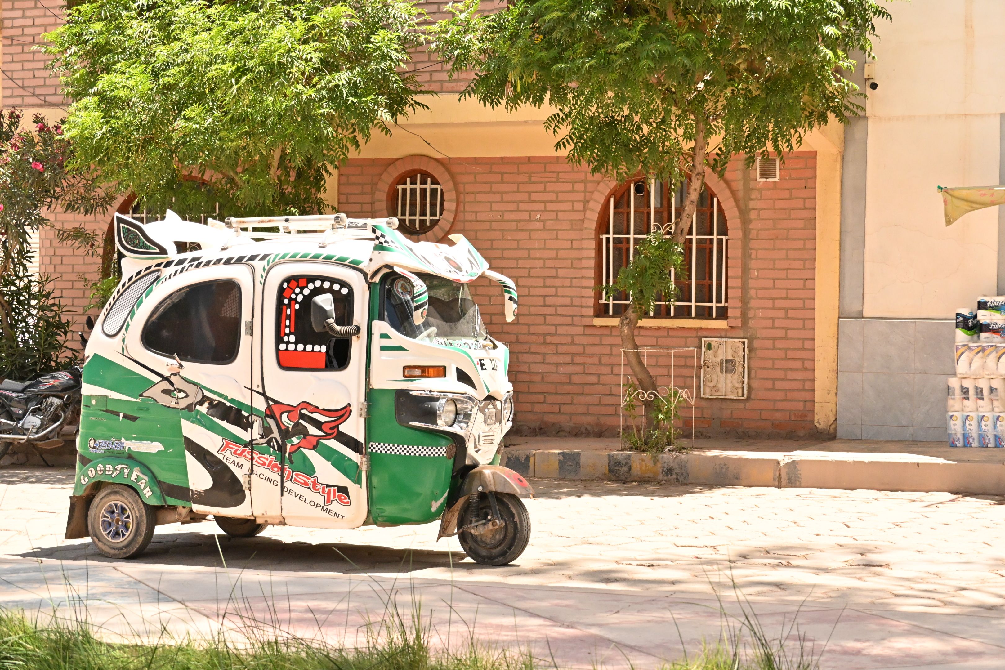 Colorful Tuk-Tuk on Sunny Urban Street · Free Stock Photo