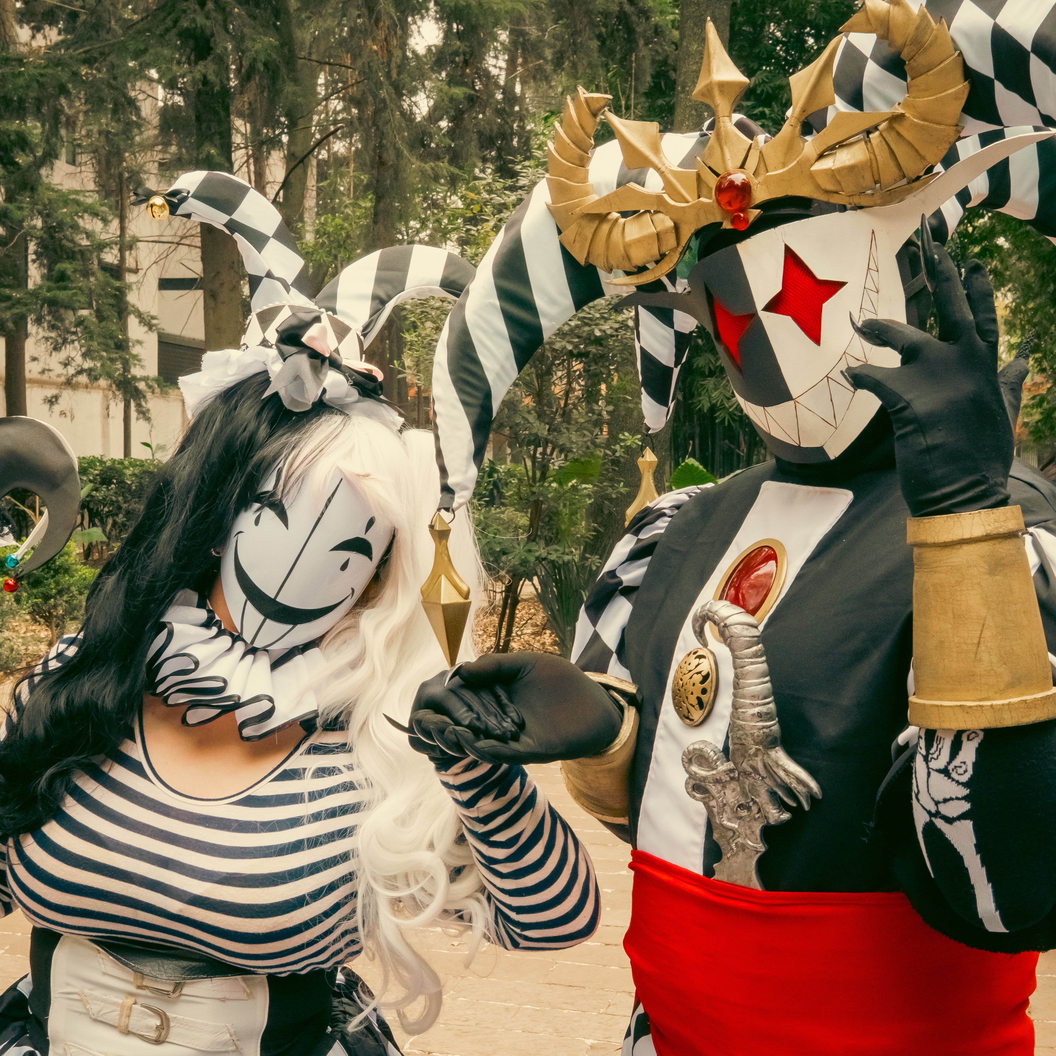 Vibrant Harlequin Costumes at Outdoor Carnival