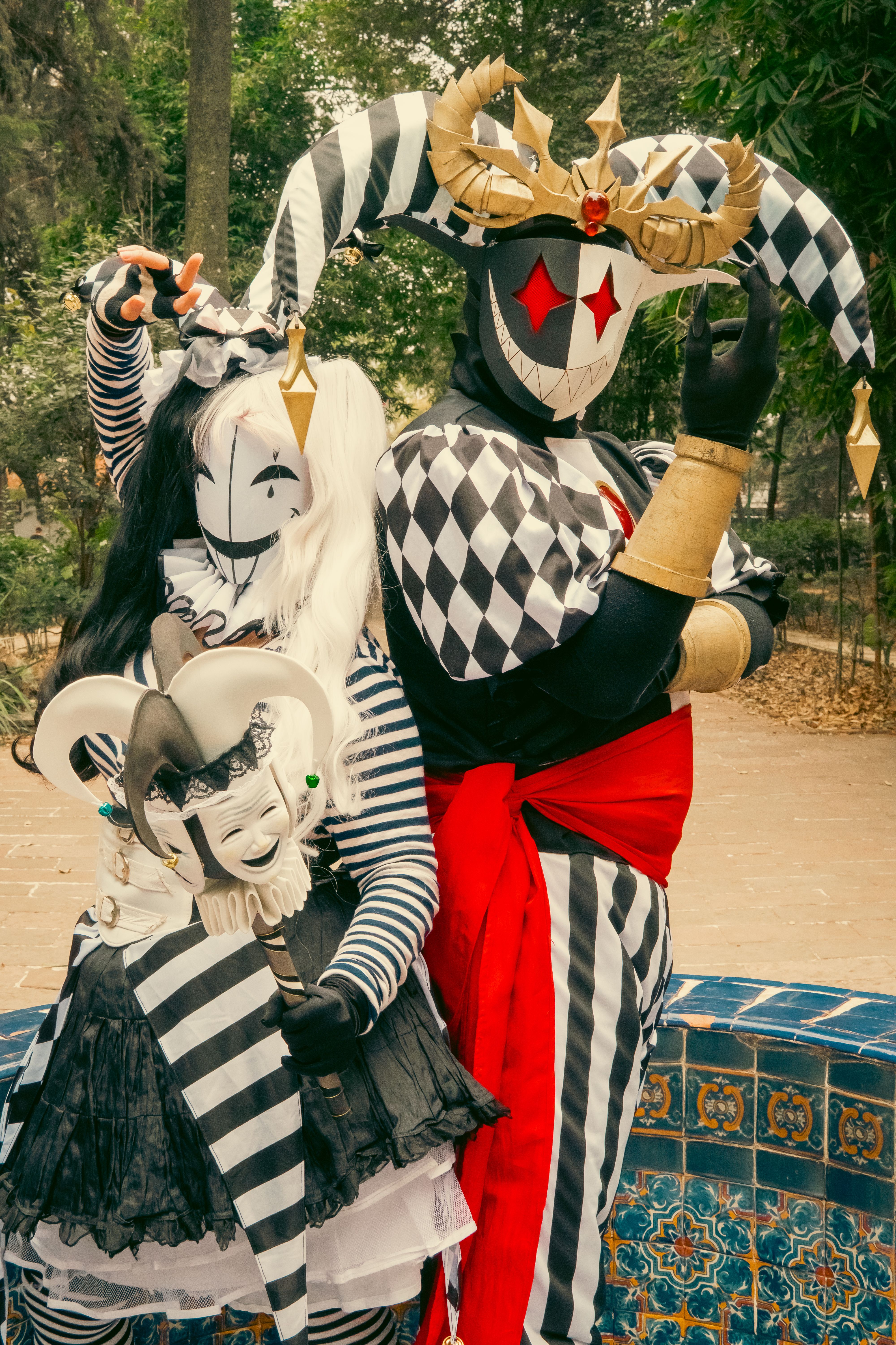 Harlequin Costumed Characters in Vibrant Carnival Setting