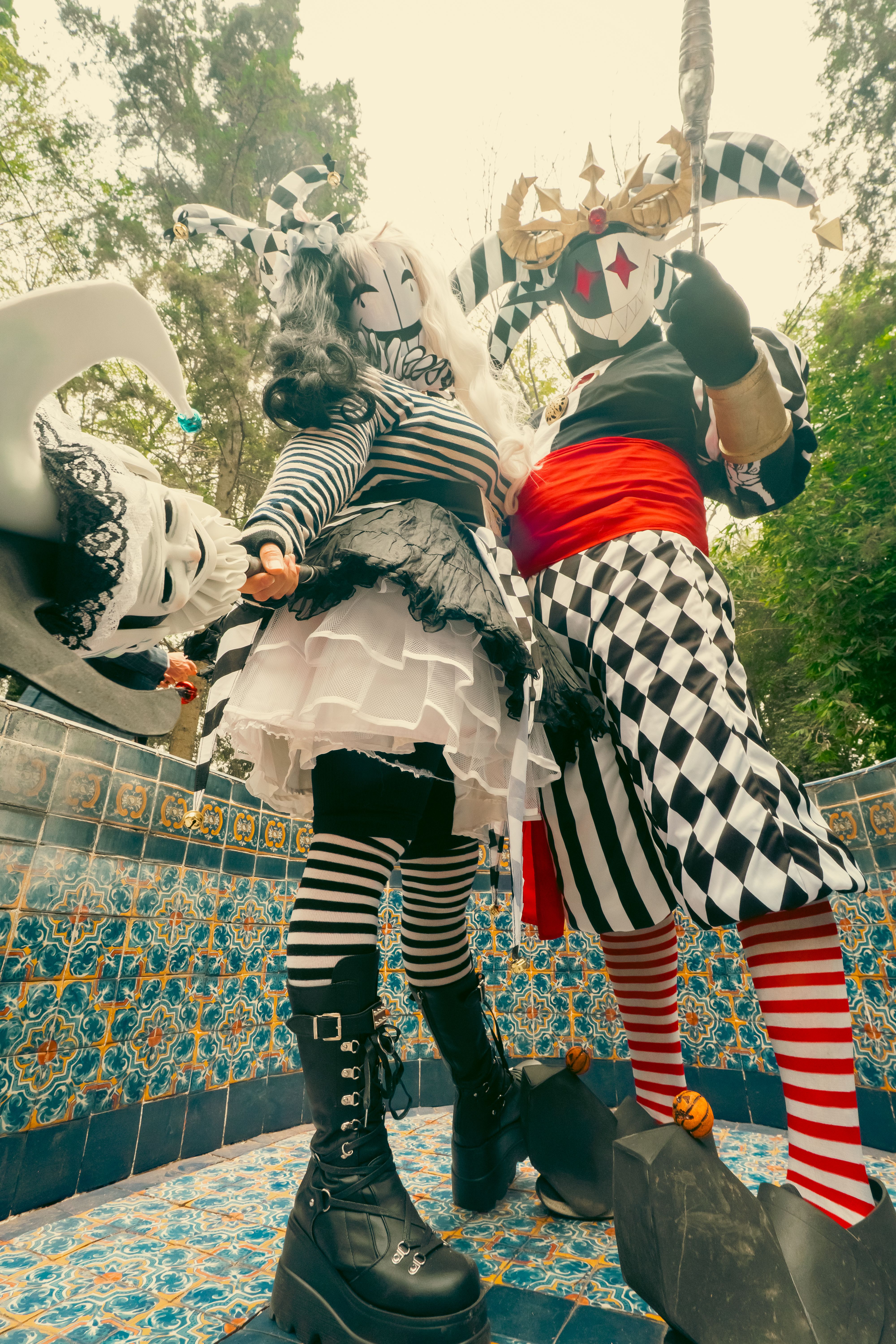 Vibrant Carnival Harlequin Costumes Outdoor Display