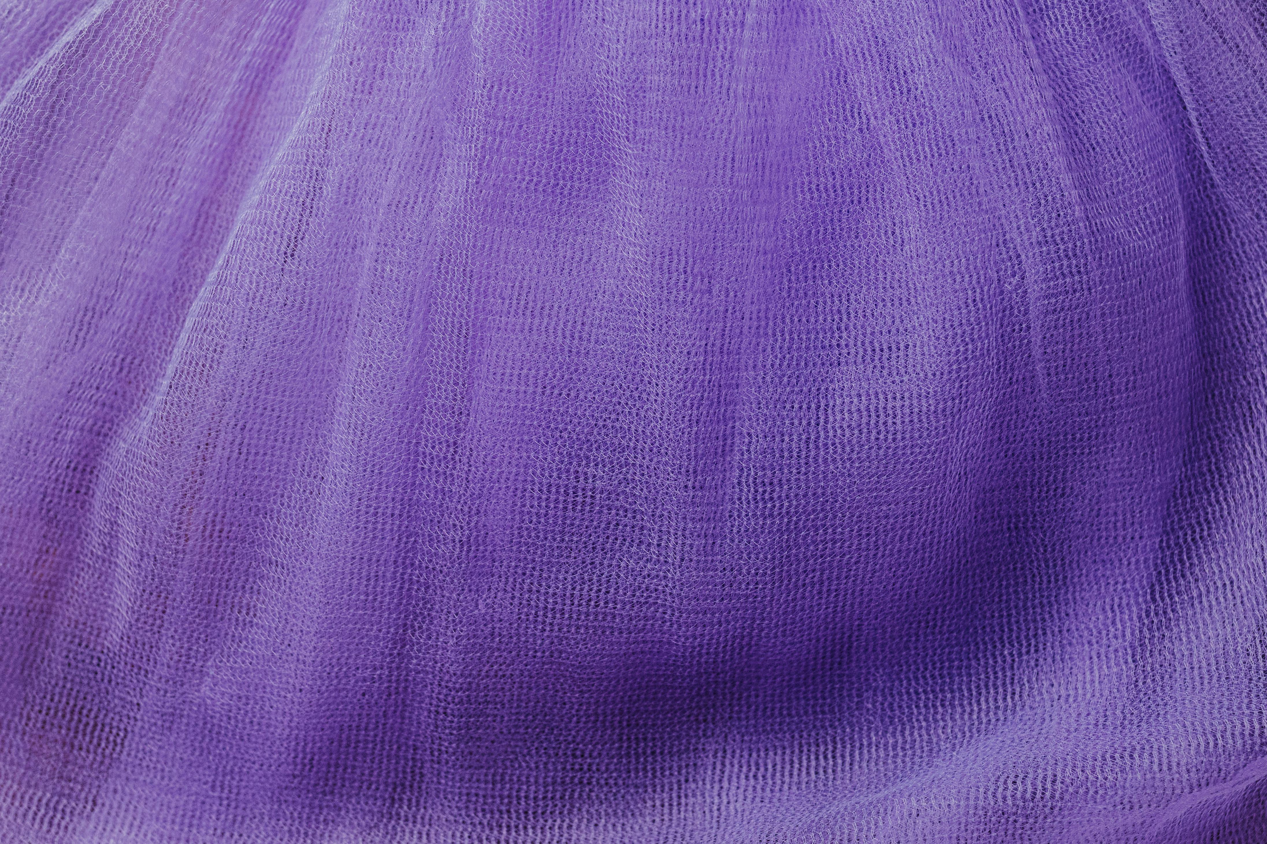 Free Close-up view of a flowing purple textile showcasing intricate weave and texture. Stock Photo