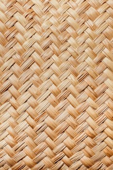 Detailed close-up image of woven straw texture, perfect for backgrounds and design elements.