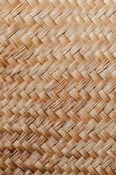 Detailed view of a natural woven straw texture, perfect for backgrounds.