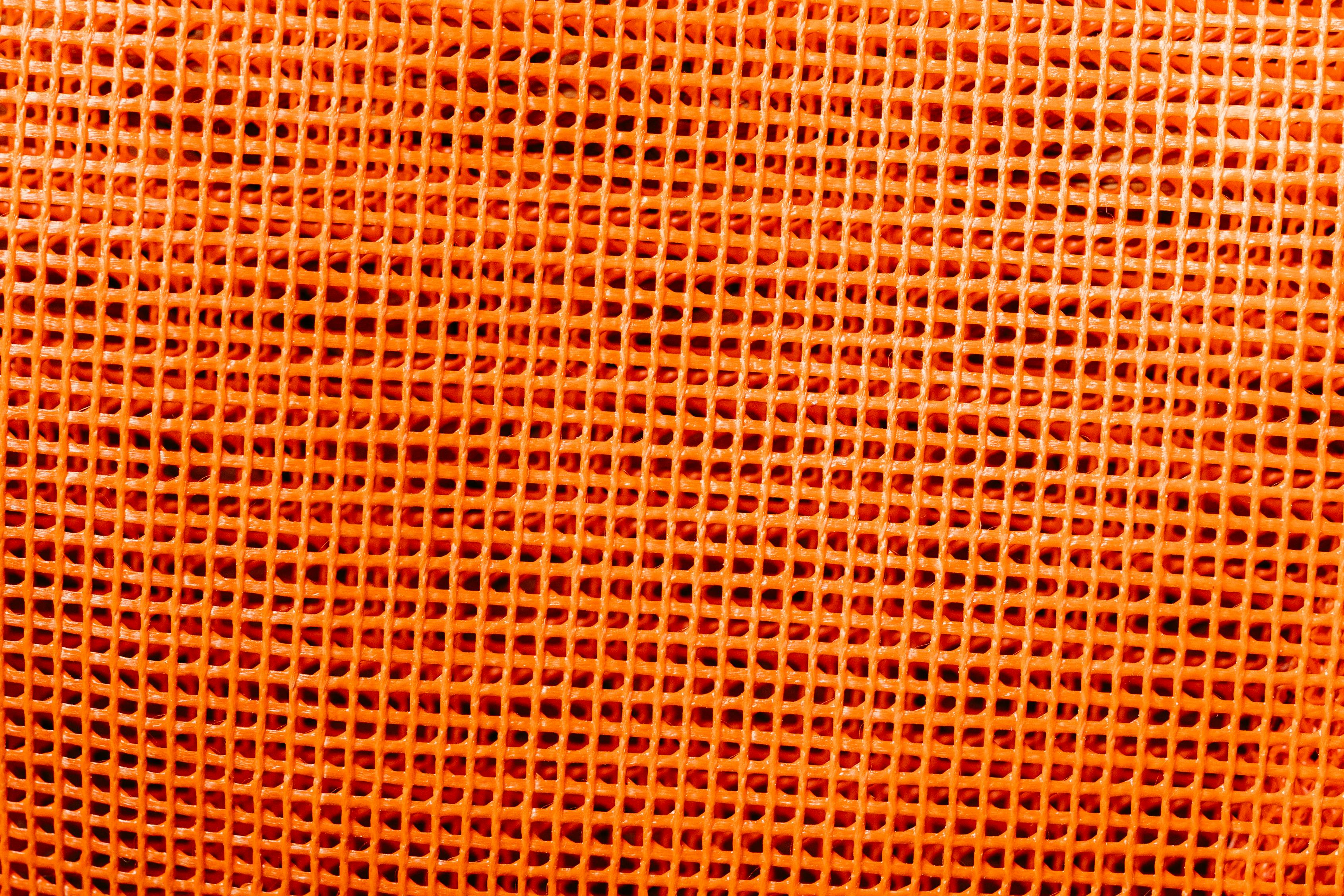 Gratis Nærbillede af en orange plastiknettekstur, der er egnet til baggrunde og design. Lagerfoto