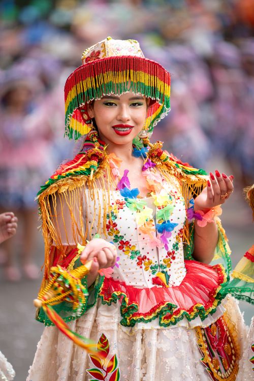 Free Cheerful Bolivian dancer in vibrant traditional clothing at a festival. Stock Photo