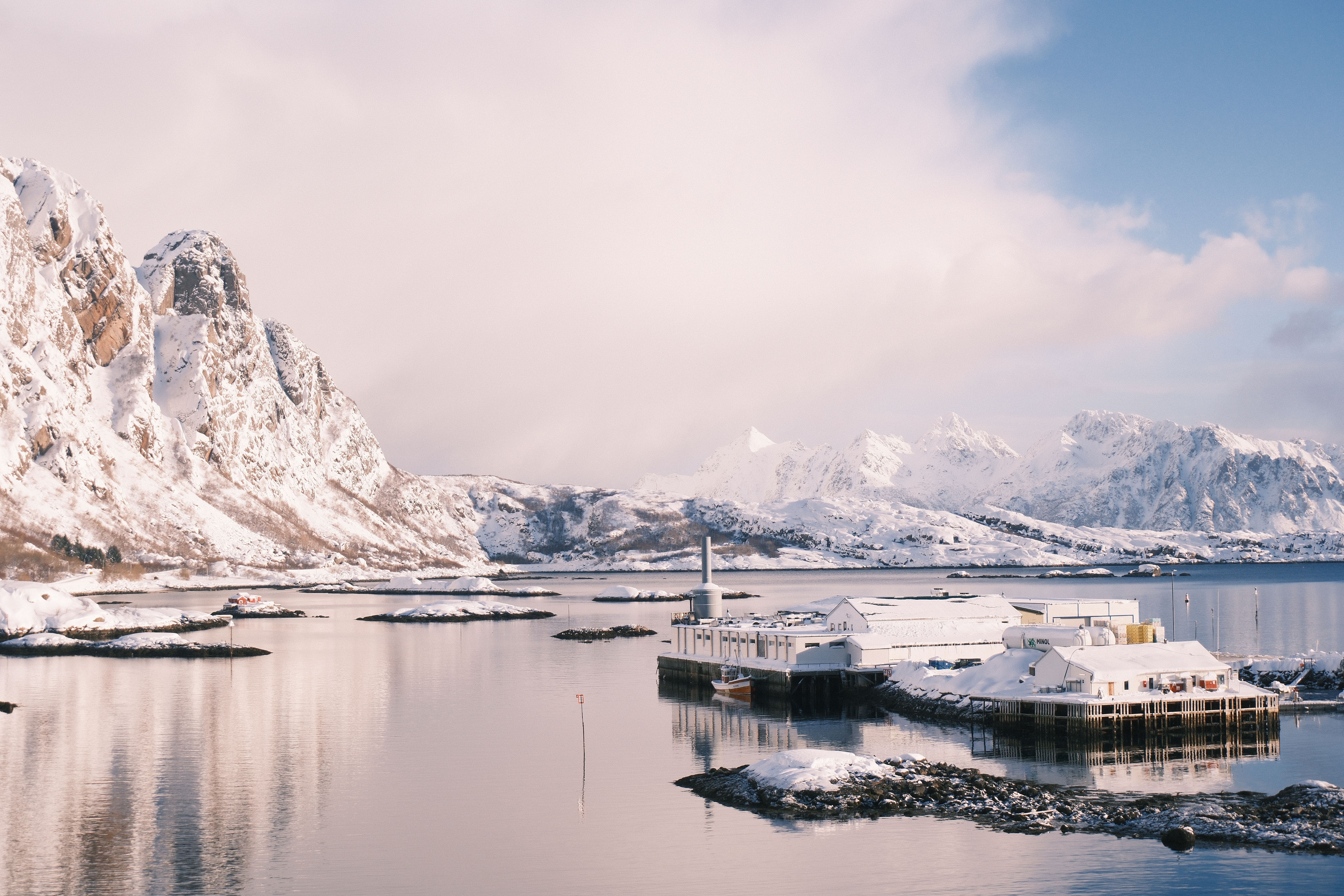 Idyllic winter scene of snowy mountains and fjord in Svolvær, Norway.