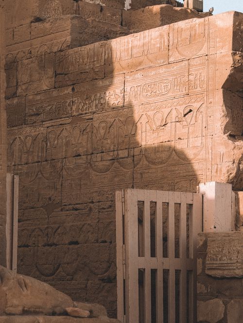 Free Historic Egyptian hieroglyphs carved in sandstone temple wall, Qena Governorate, Egypt. Stock Photo