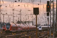 Trains at Sunset in Busy Urban Rail Yard