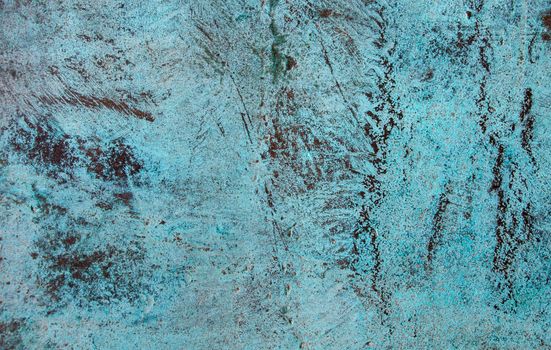 Close-up of a rustic blue textured surface with unique patterns creating an abstract art feel.