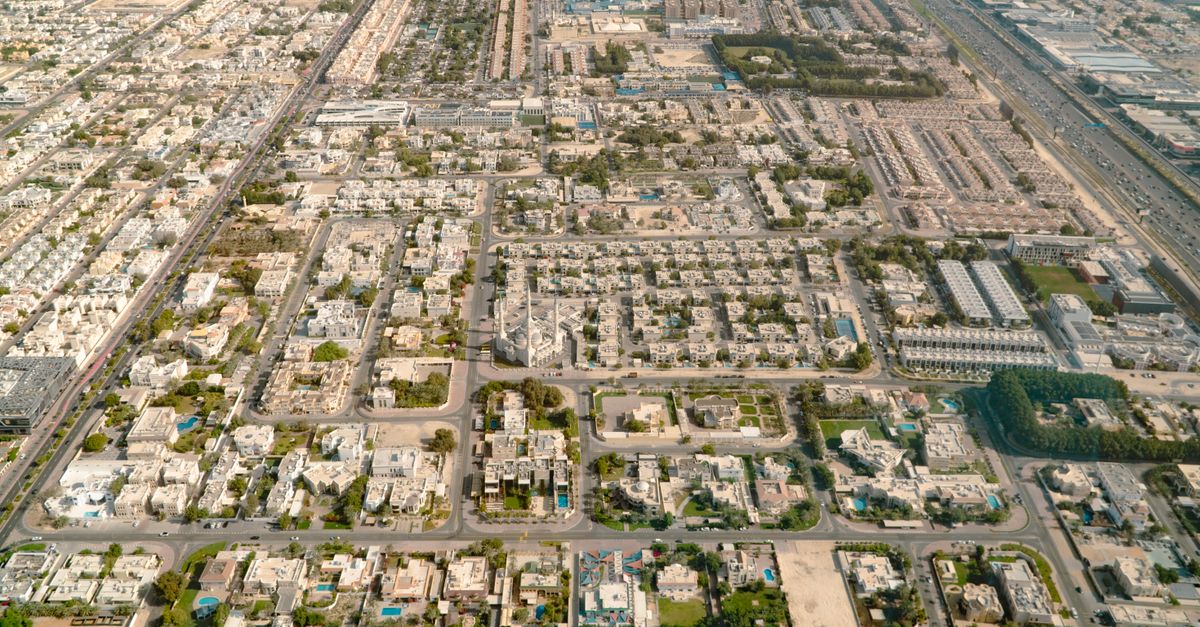 Aerial photo showing detailed layout of urban residential area with roads and buildings.