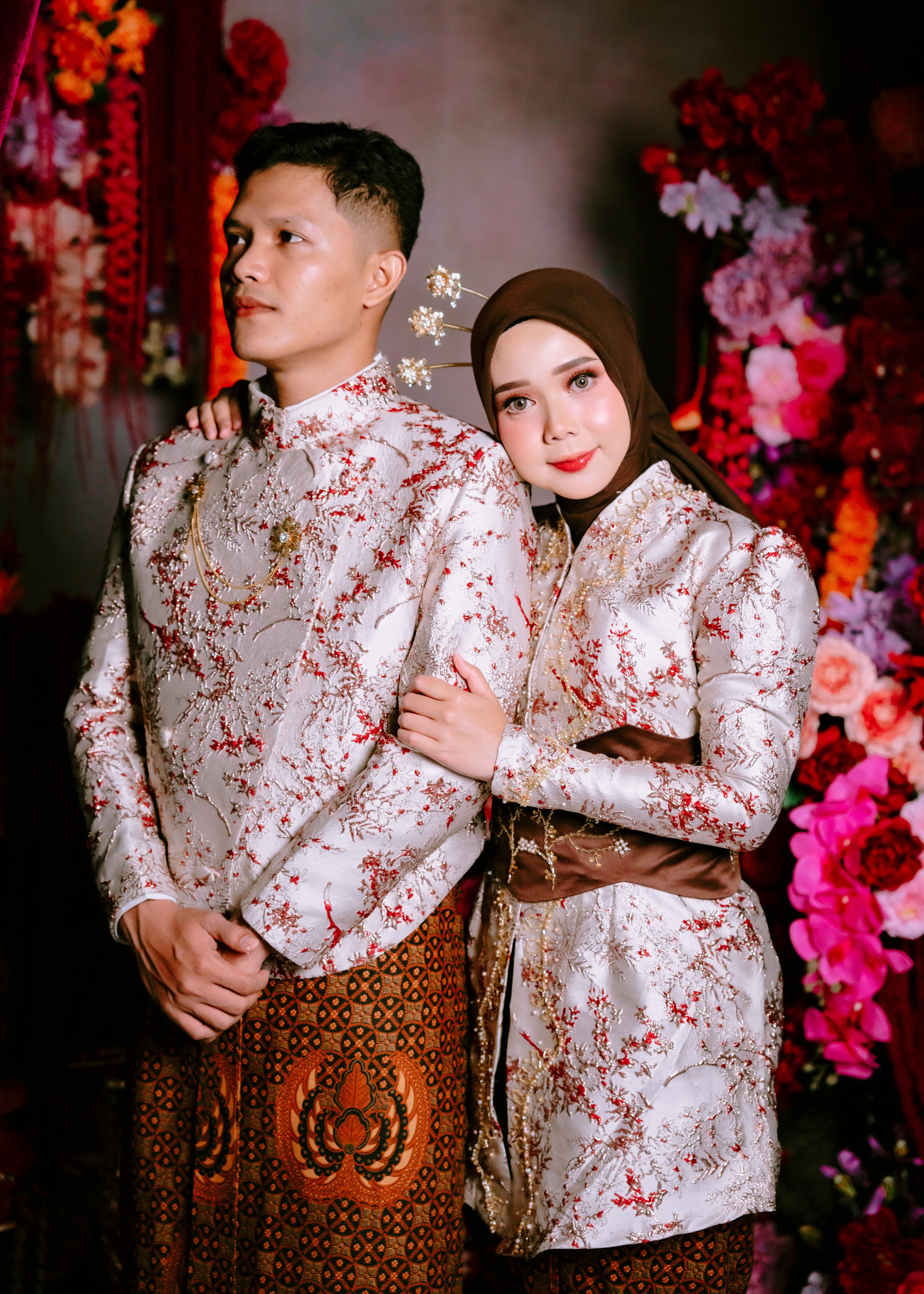 Elegant Couple in Traditional Attire Portrait · Free Stock Photo