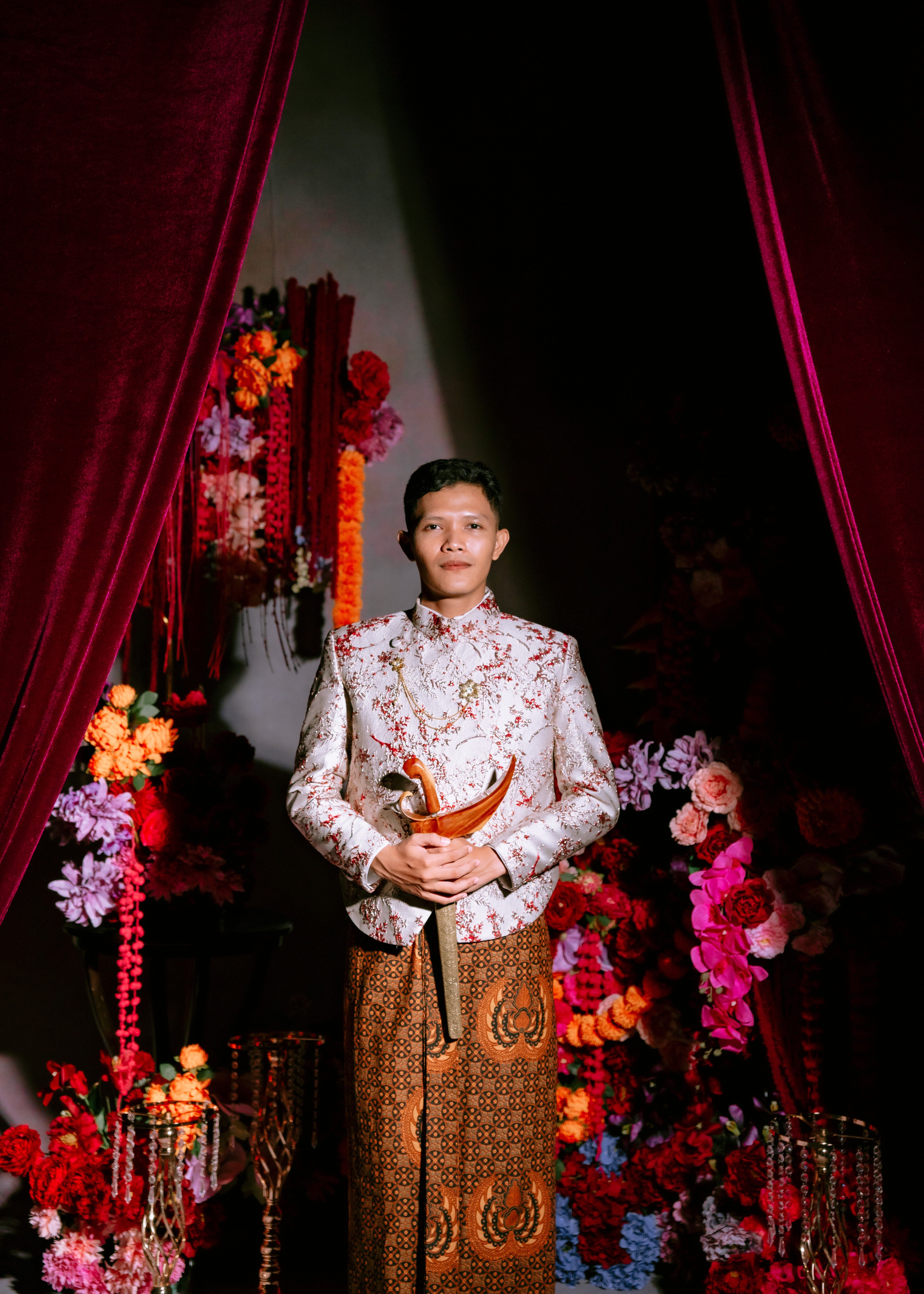 Traditional Wedding Portrait with Floral Backdrop