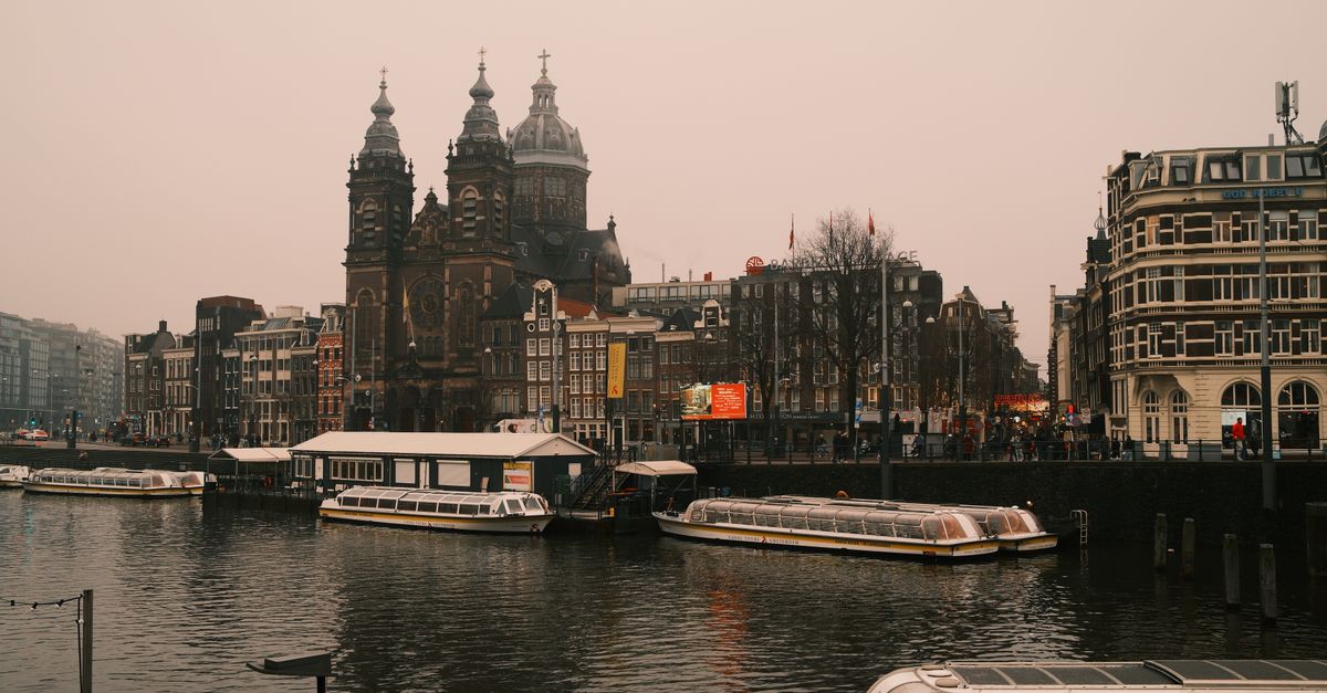 Historic canal houses along an Amsterdam canal.