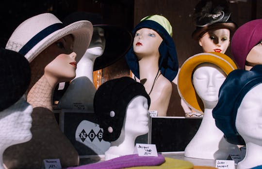 Colorful and stylish hat display featuring various designs in a shop window.