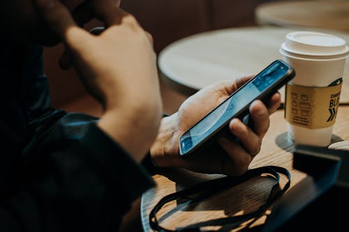 Person Holding Mobile Phone