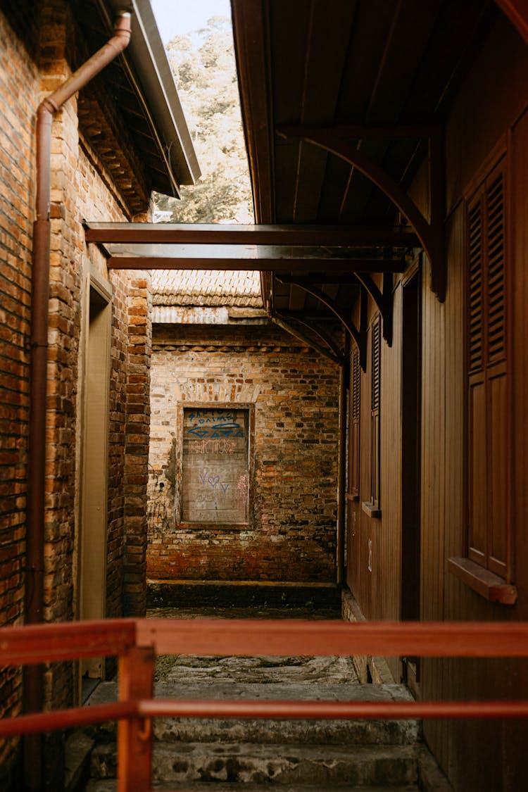 A Brick House With A Wooden Windows