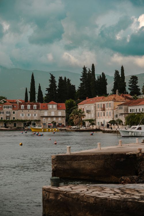 Free Explore the coastal beauty and historic architecture of a charming town in Karadağ. Stock Photo