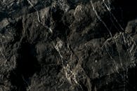 Textured Dark Marble Stone Surface Closeup