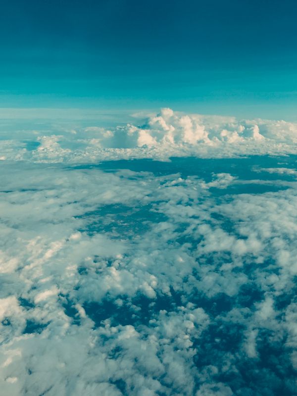 Aerial view of majestic clouds and blue sky