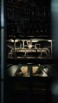 Close-up view of an industrial textile machine active in a factory.