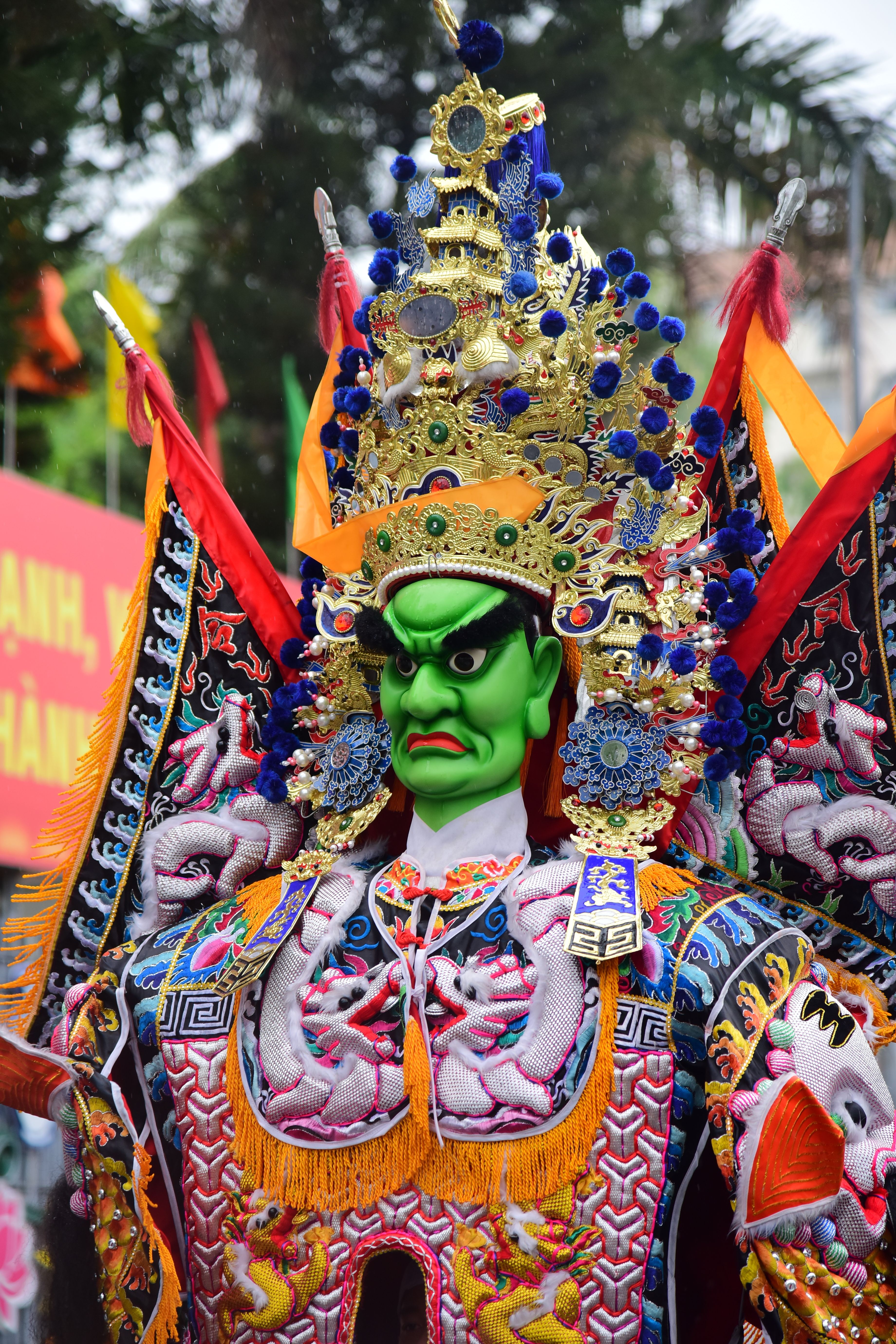 Colorful traditional mask and costume at a vibrant cultural festival.