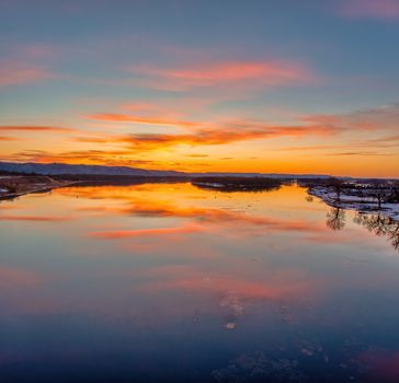 A vibrant sunset reflecting on the Mississippi River in Wabasha, Minnesota.