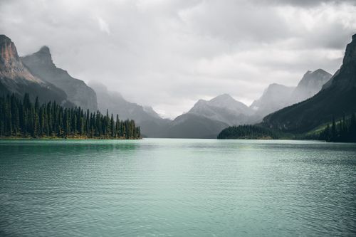 Free Breathtaking view of picturesque turquoise lake surrounded by mountains. Perfect for nature lovers. Stock Photo