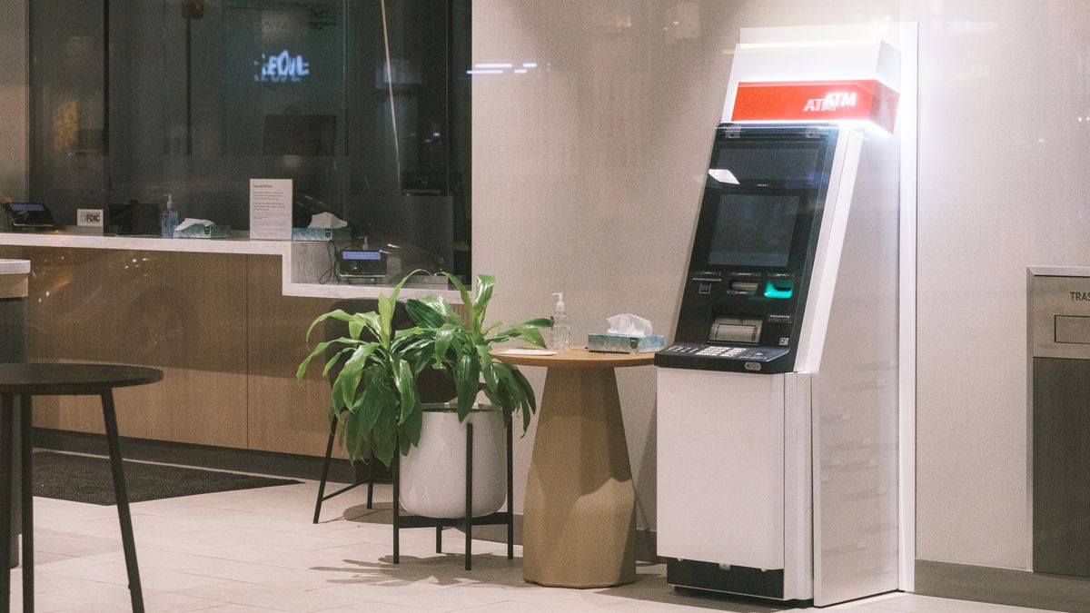 Stricter sector rules for banking, health and IoT ATM in a modern bank lobby