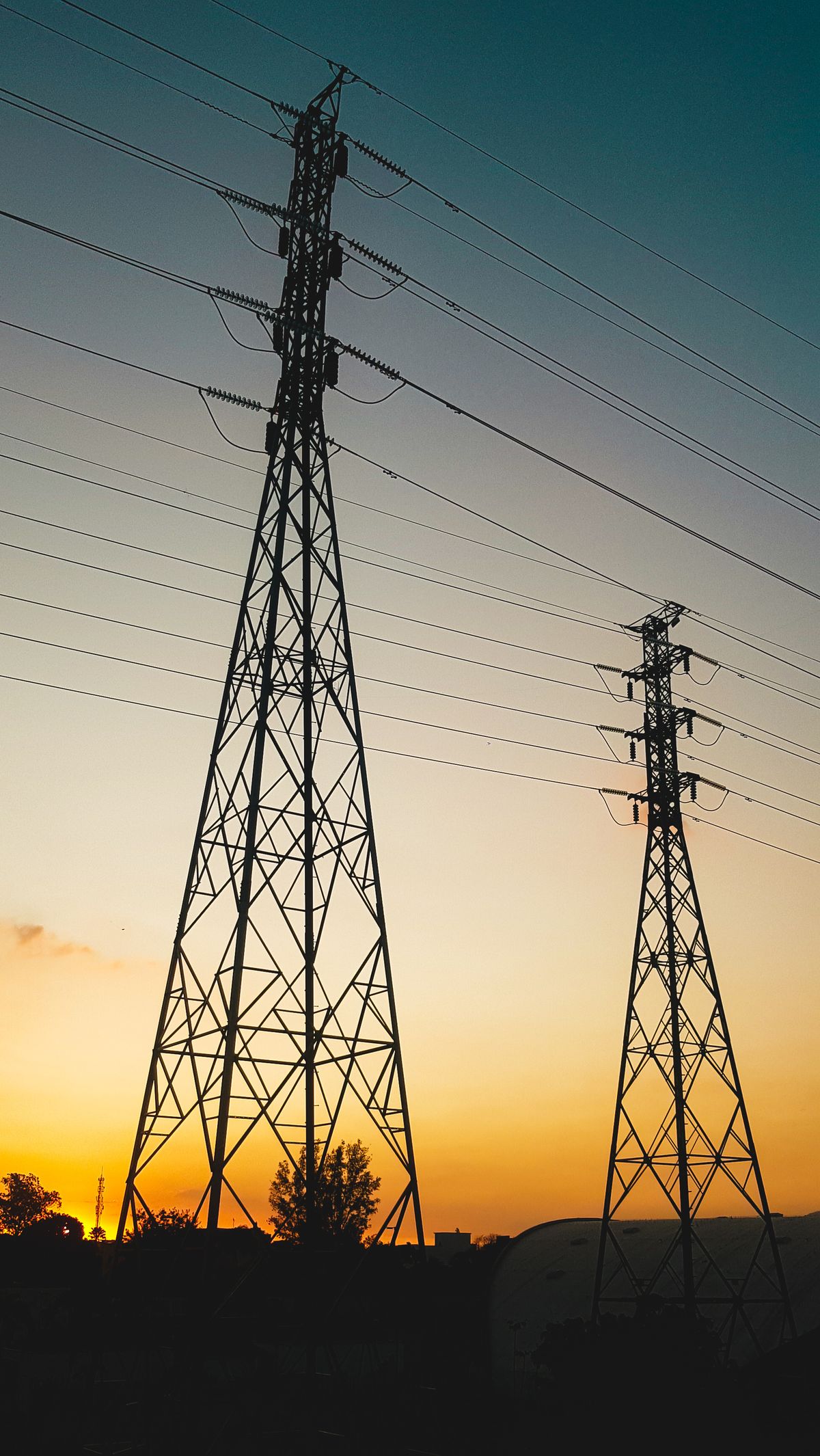Electricity transmission towers at sunset