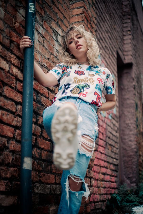 Woman in ripped jeans and graphic tee