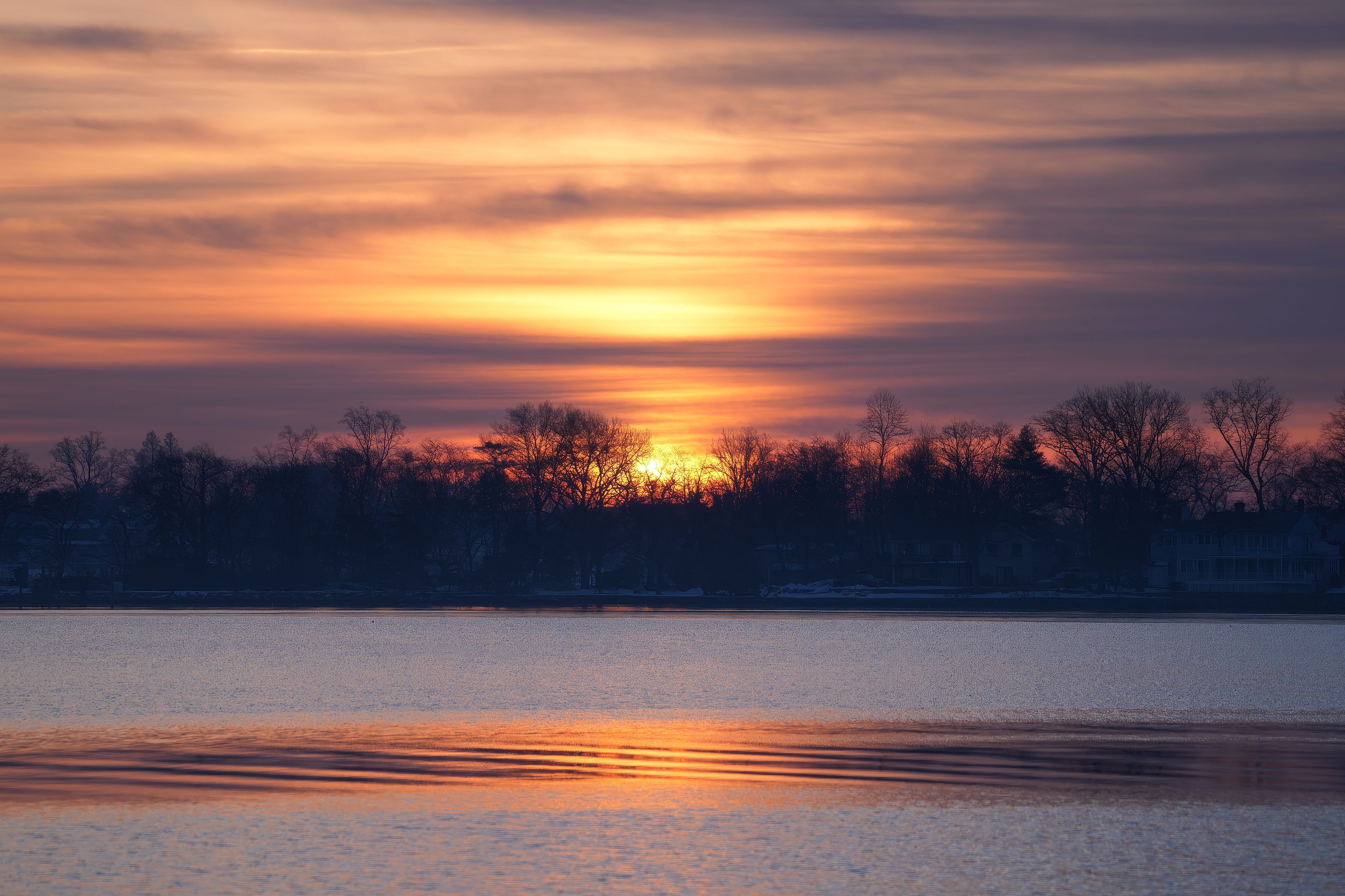 Serene Sunset Over Tranquil Lake Surface · Free Stock Photo